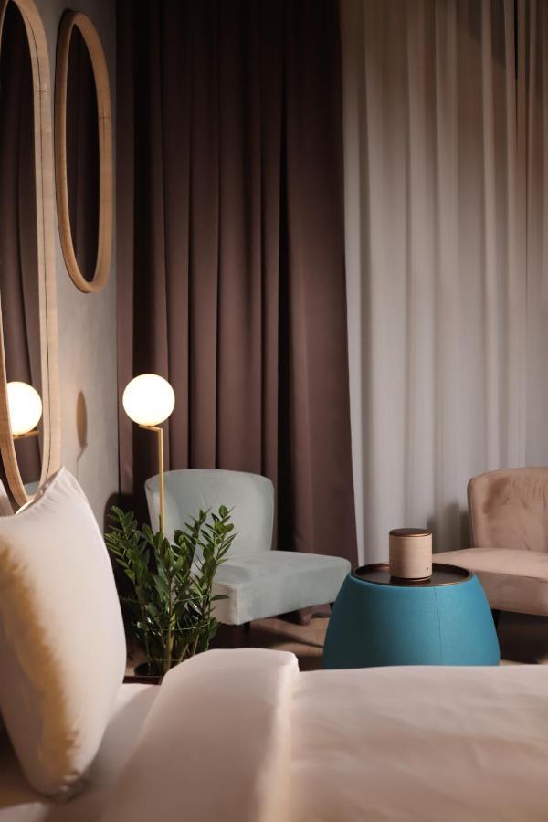The Veil Hotel Nur-Sultan  Exterior photo Curtains in a living room